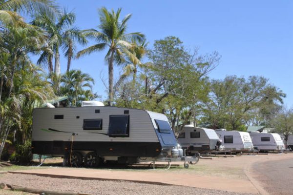 Caravans parking in outdoors campsite during summer travel holiday vacation.