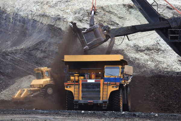 A,Haul,Truck,Is,Being,Loaded,With,Dirt,And,Ore