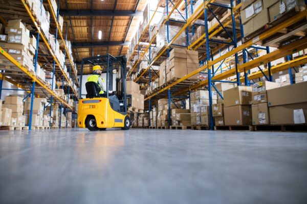 warehouse-man-worker-with-forklift-picture-id897280394