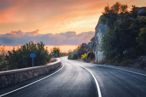 Mountain,Road,At,Sunset.,Landscape,With,Rocks,,Orange,Sunny,Sky